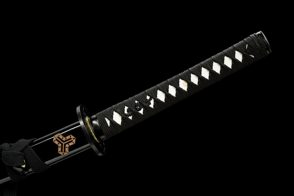 Black tsuka-ito wrap over a white textured handle underlay