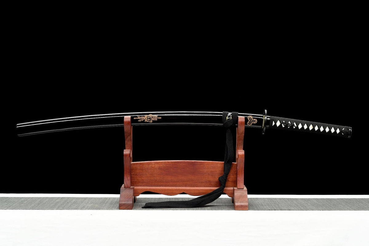 Kokuryu Katana sheathed in its carved black lacquered saya