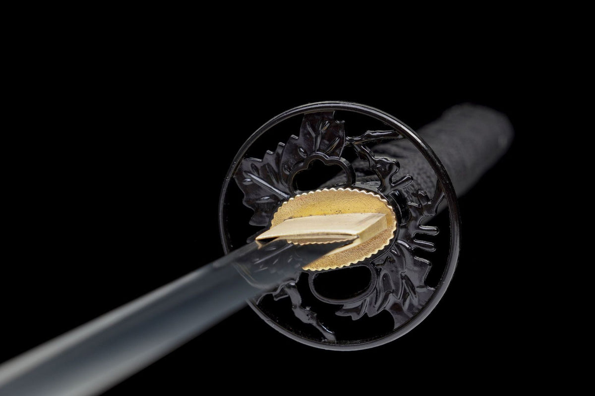 Black openwork leaf tsuba and gold habaki on Black Maple Katana