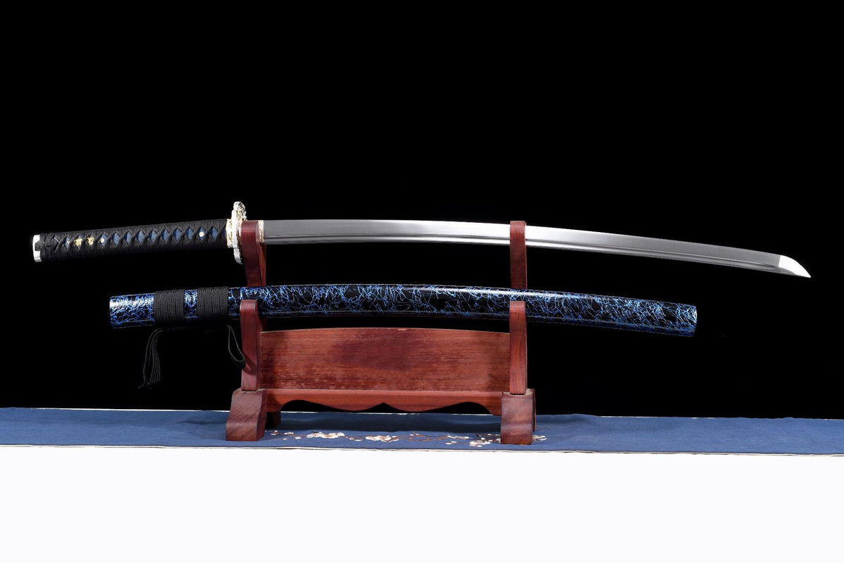 Blue Crackle Katana displayed unsheathed above its lacquered wooden saya