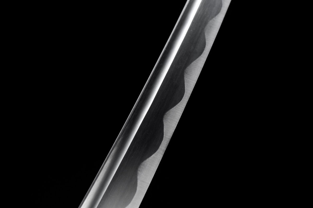 Close view of the decorative wavy line on the polished blade