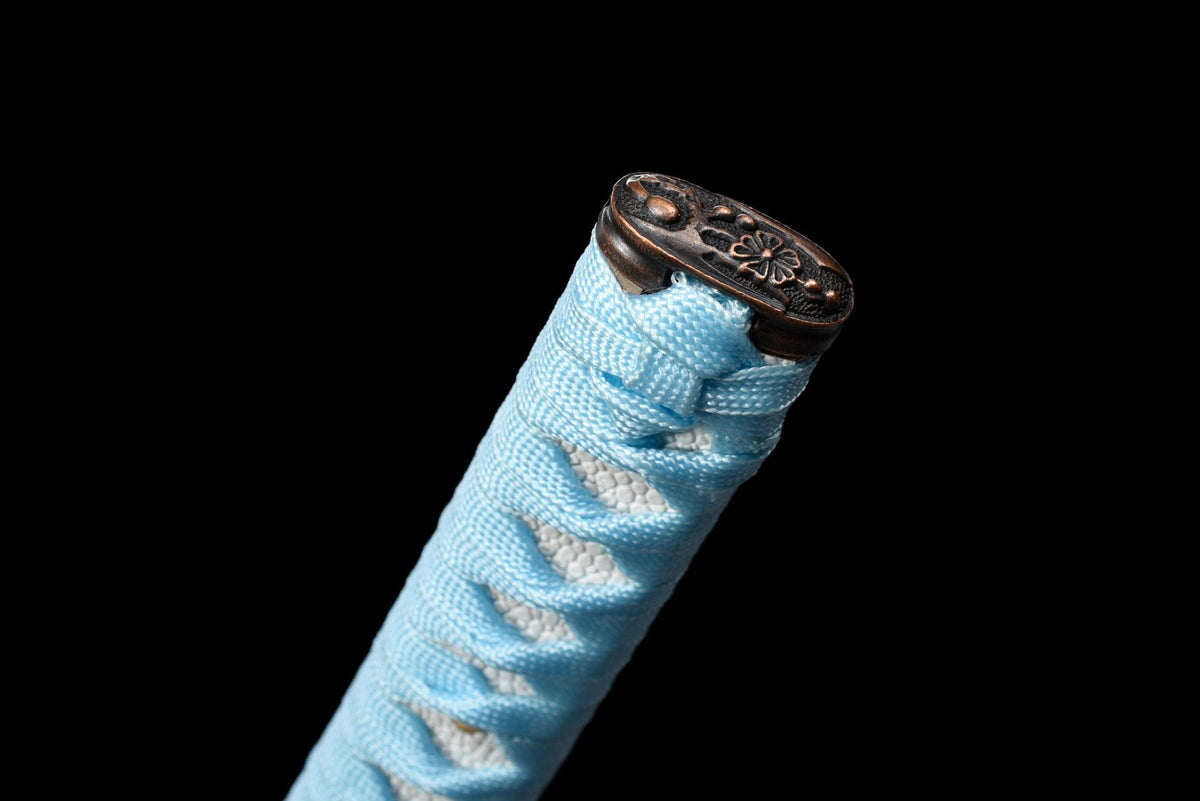 Dark pommel with light blue handle wrap