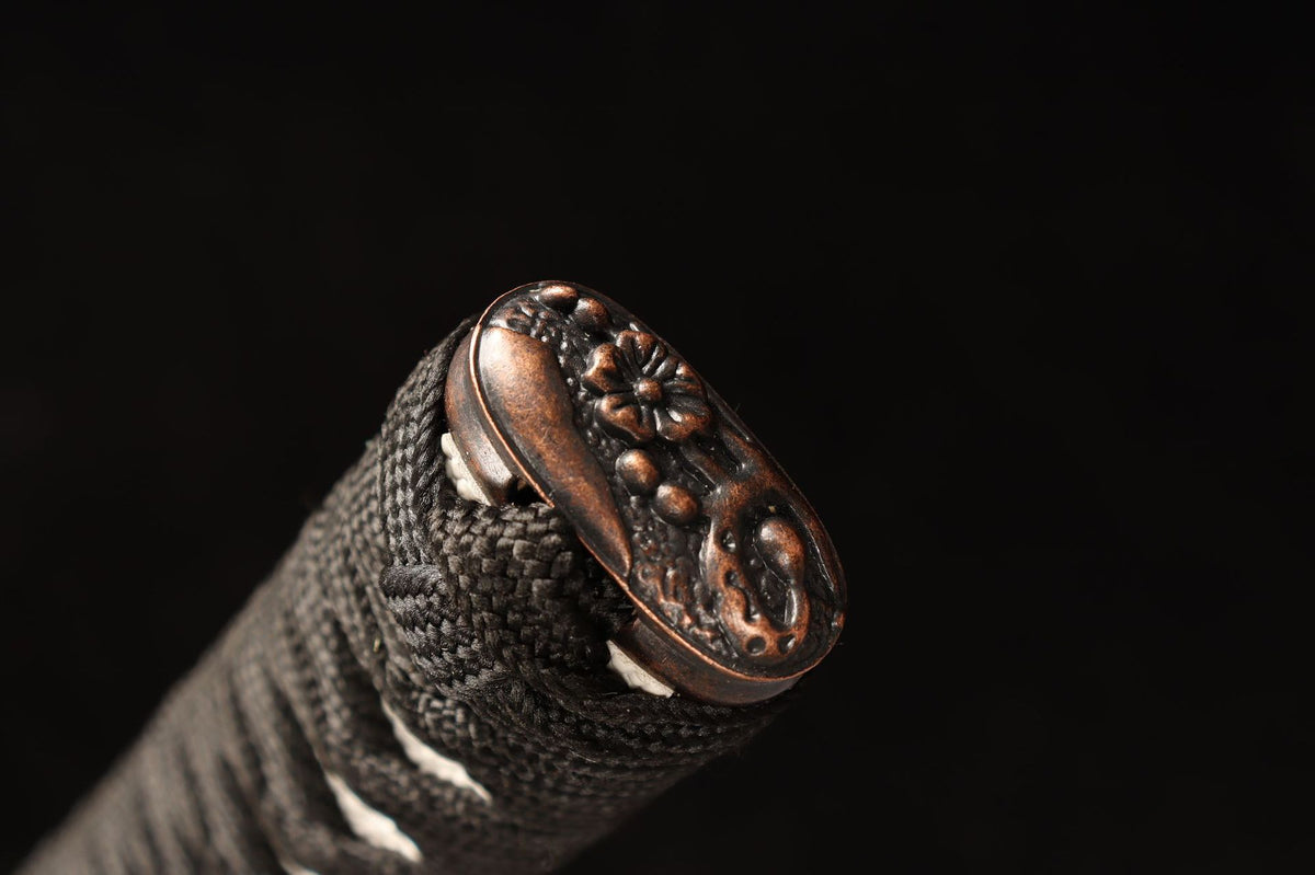 Floral kashira detail on the Emberflow Katana tsuka
