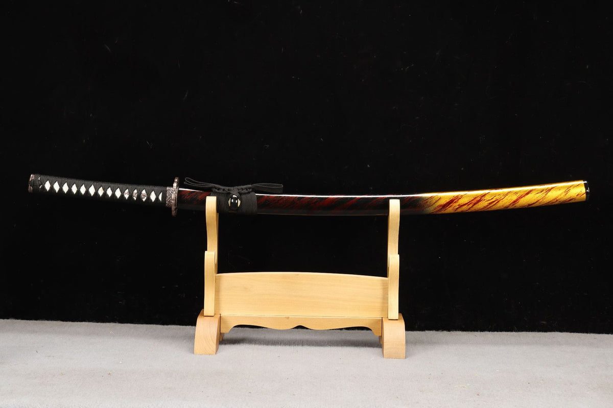 Emberflow Katana sheathed in its amber, red, and black lacquered saya