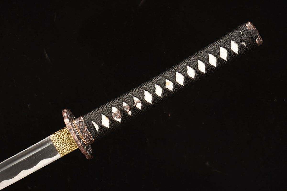 Black-wrapped tsuka and floral fittings on the Emberflow Katana