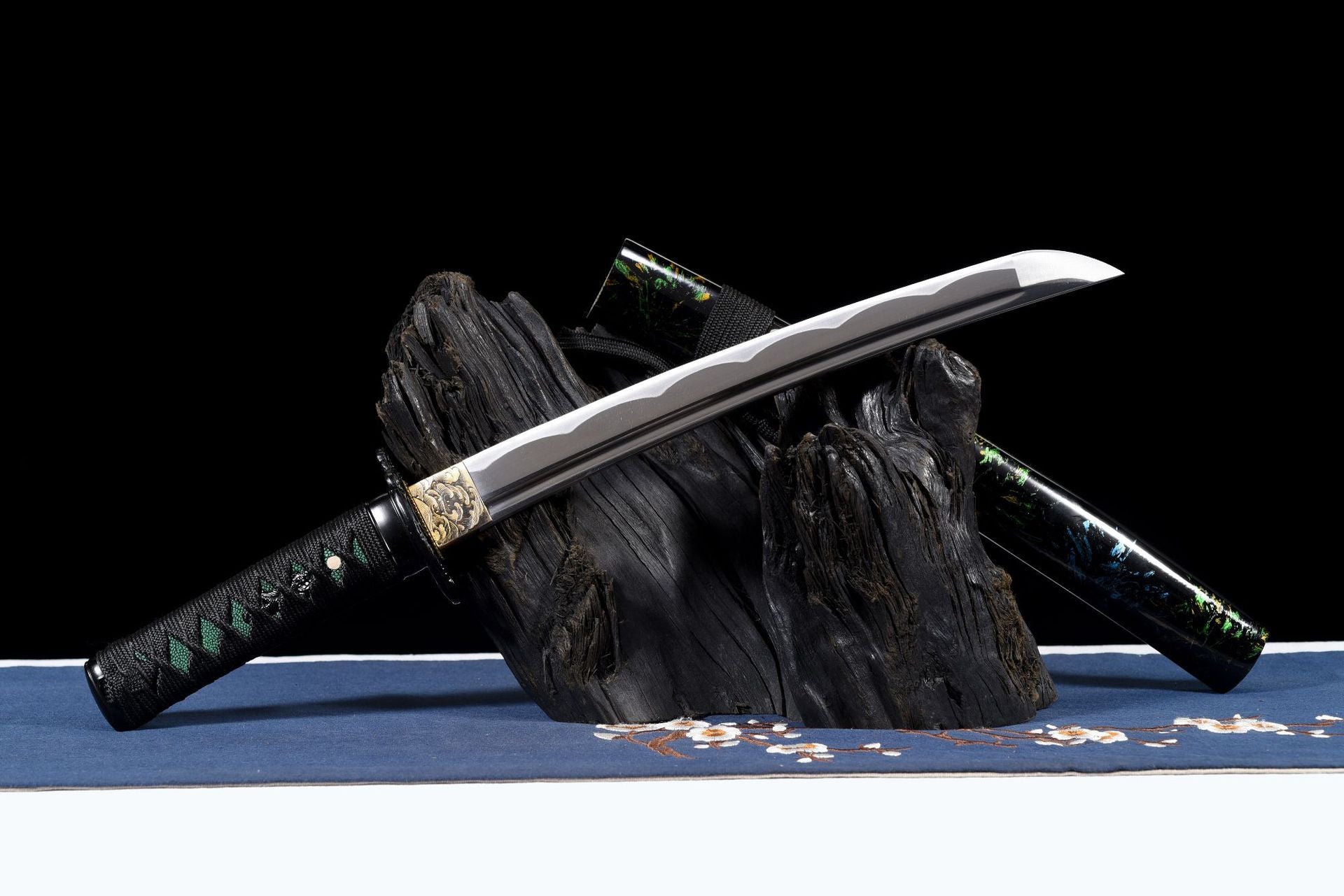 Grooved blade with black tsuba and gold-tone habaki detail