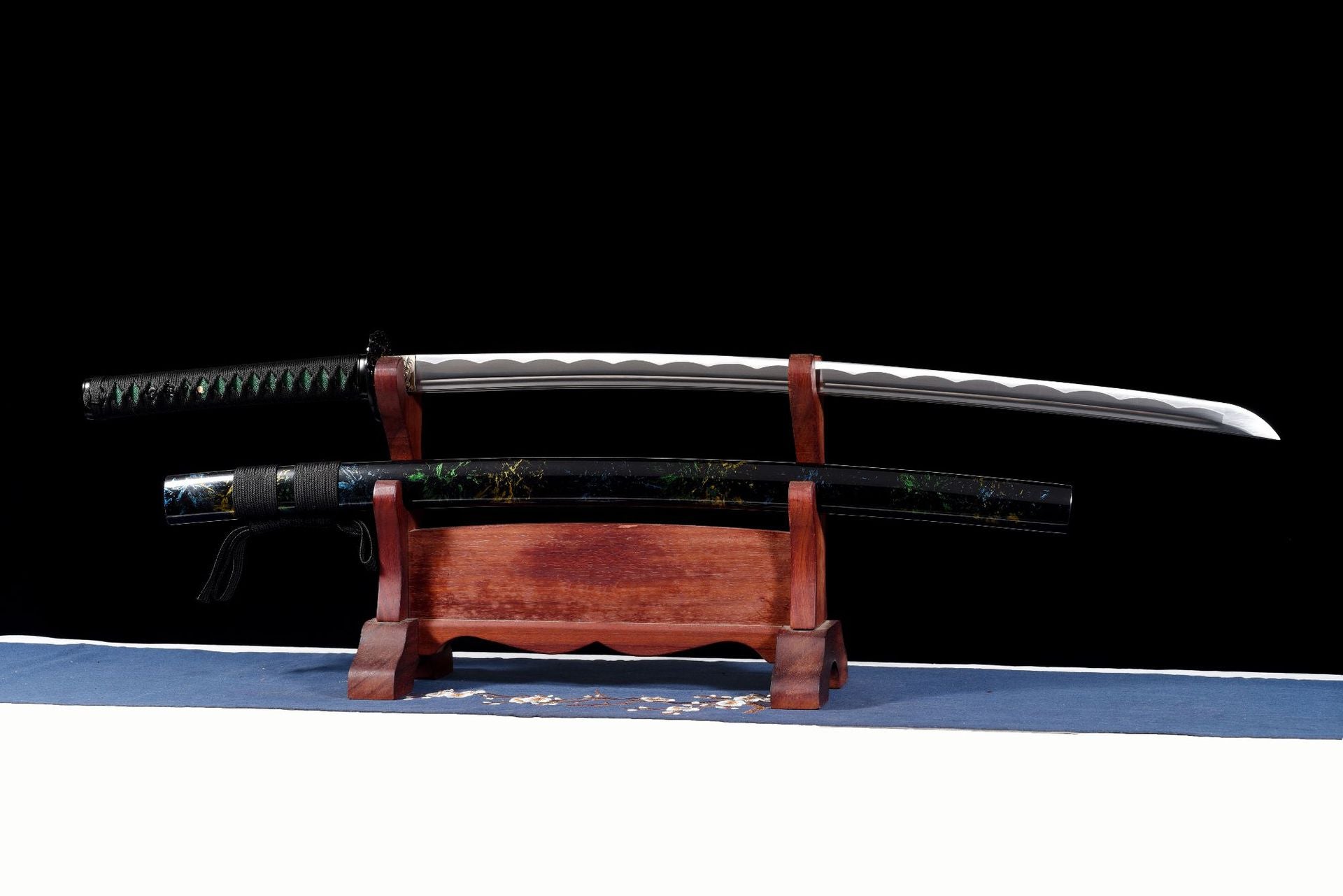 Sharpened Emerald Shadow Katana displayed above its black lacquered saya