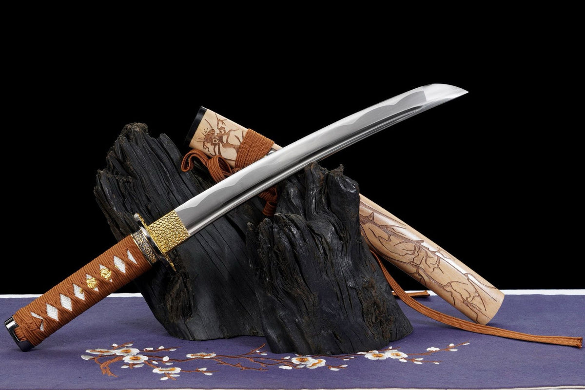 Nightingale wakizashi with polished blade and carved pale wood saya