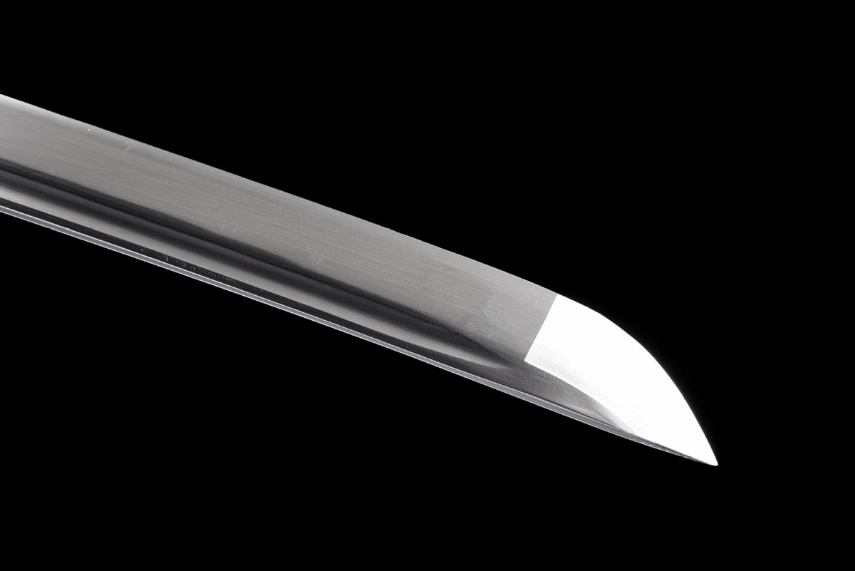 Close view of the sharpened edge and polished kissaki of the Inkstorm Katana