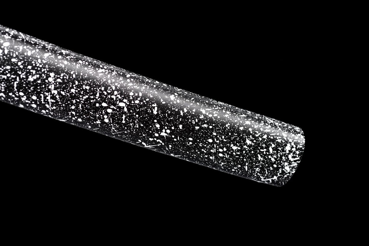Close view of the black lacquered solid-wood saya with dense white splatter finish