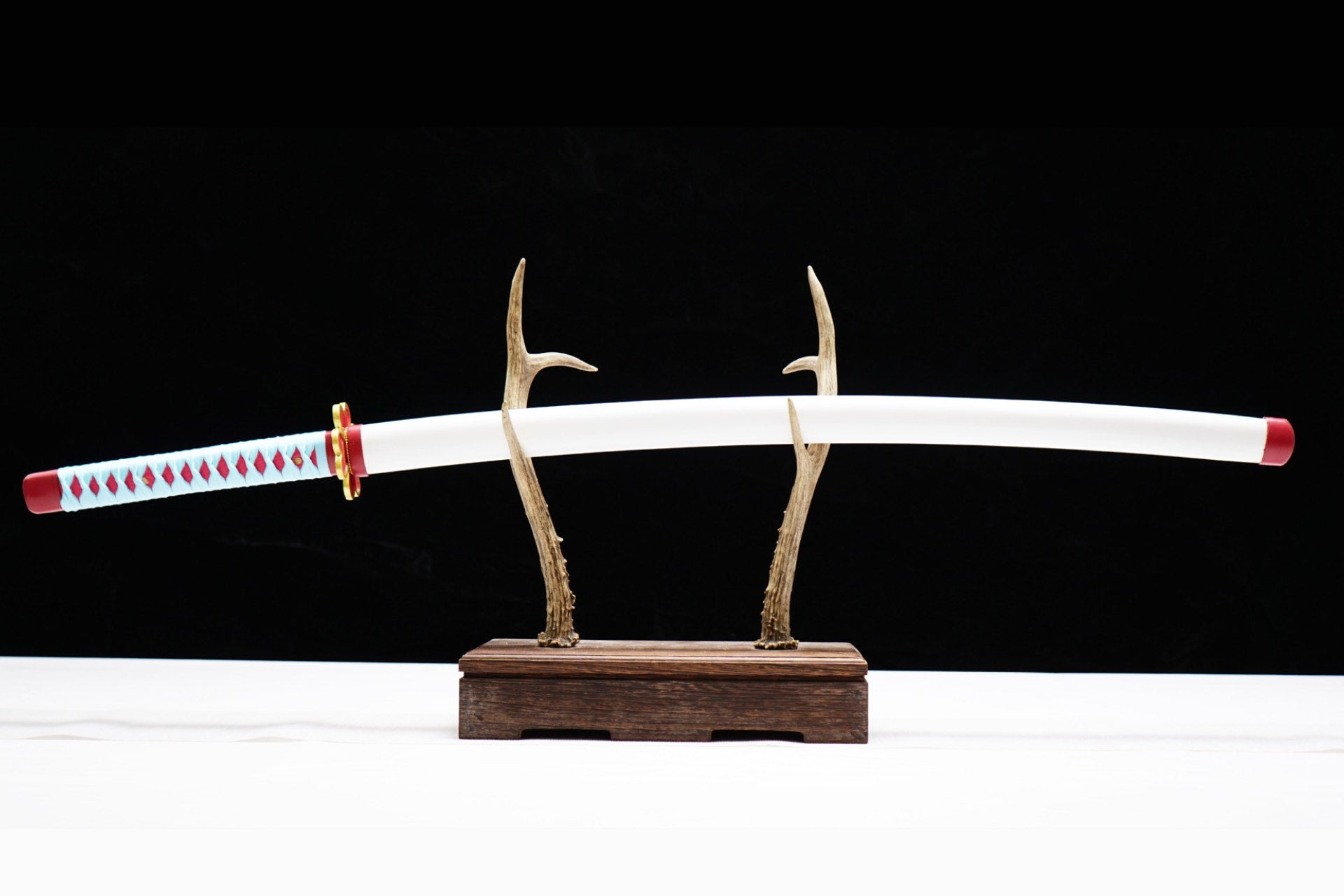 Full sheathed view of Kanroji Mitsuri Katana with pale blue handle wrap and white scabbard
