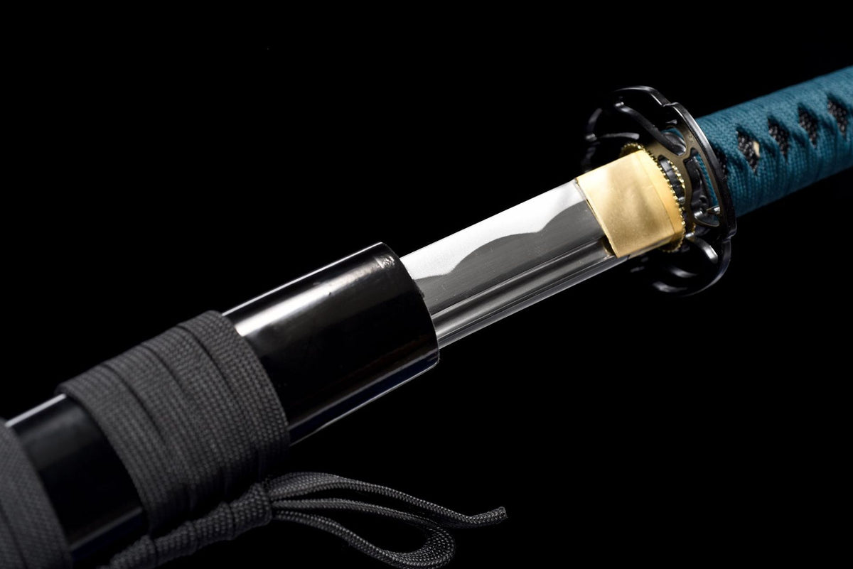 Gold-tone habaki and black sukashi tsuba on the Karahana Katana