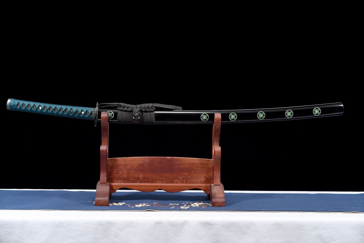 Karahana Katana sheathed in a black saya with pale green floral roundels