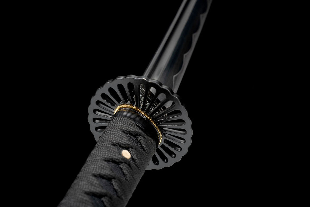 Black kiku sukashi chrysanthemum tsuba close-up