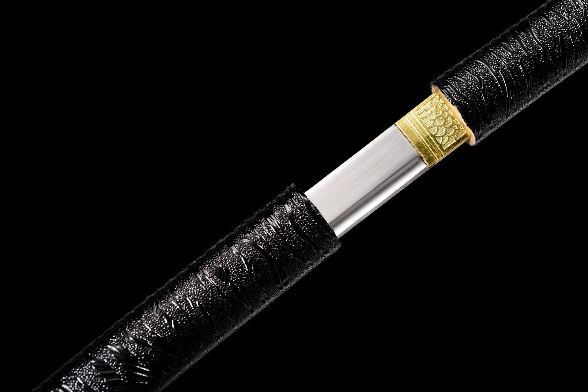 Patterned gold-tone habaki on the Shadow Bamboo Katana