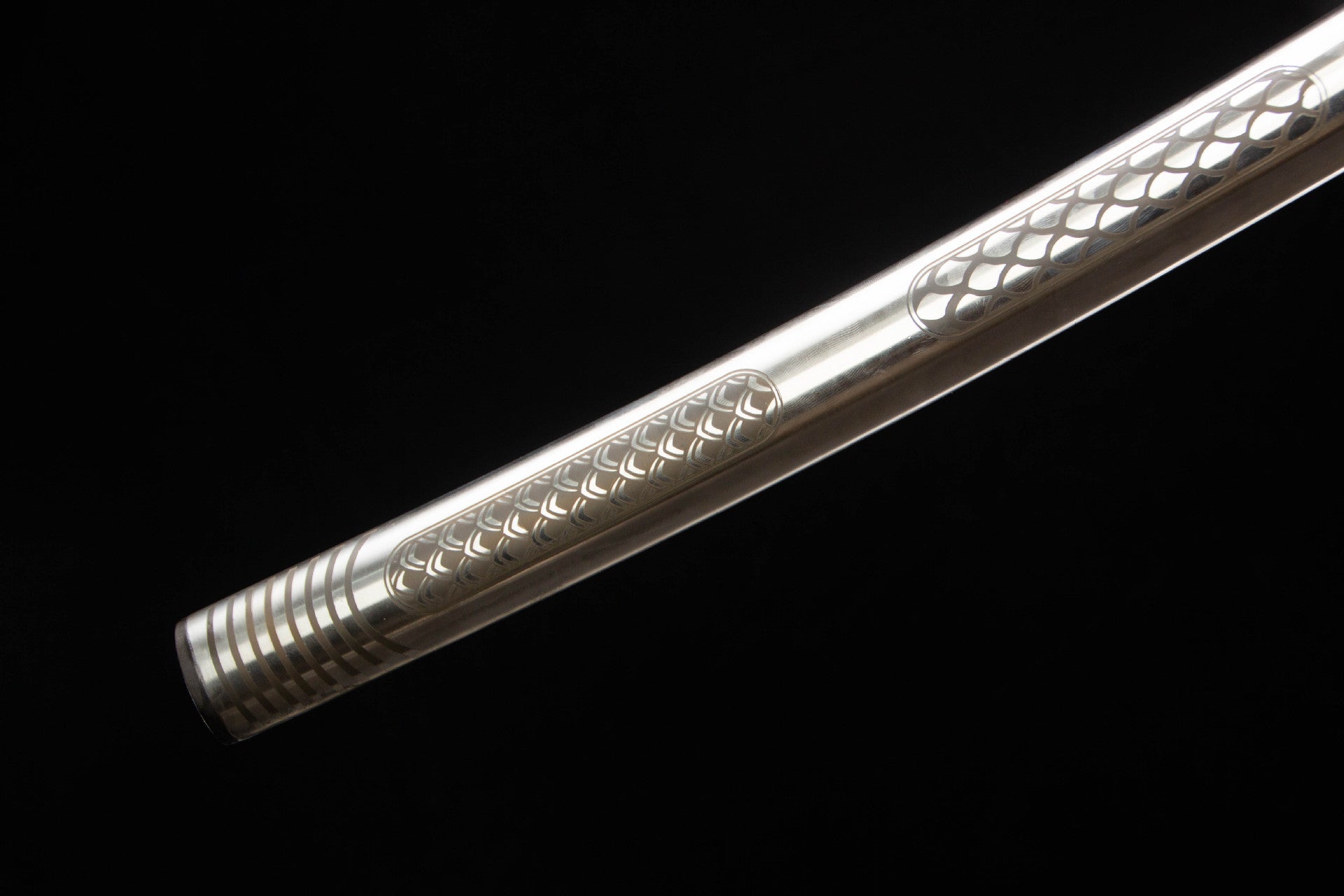 Ringed end section and scale-pattern detail on the stainless steel saya