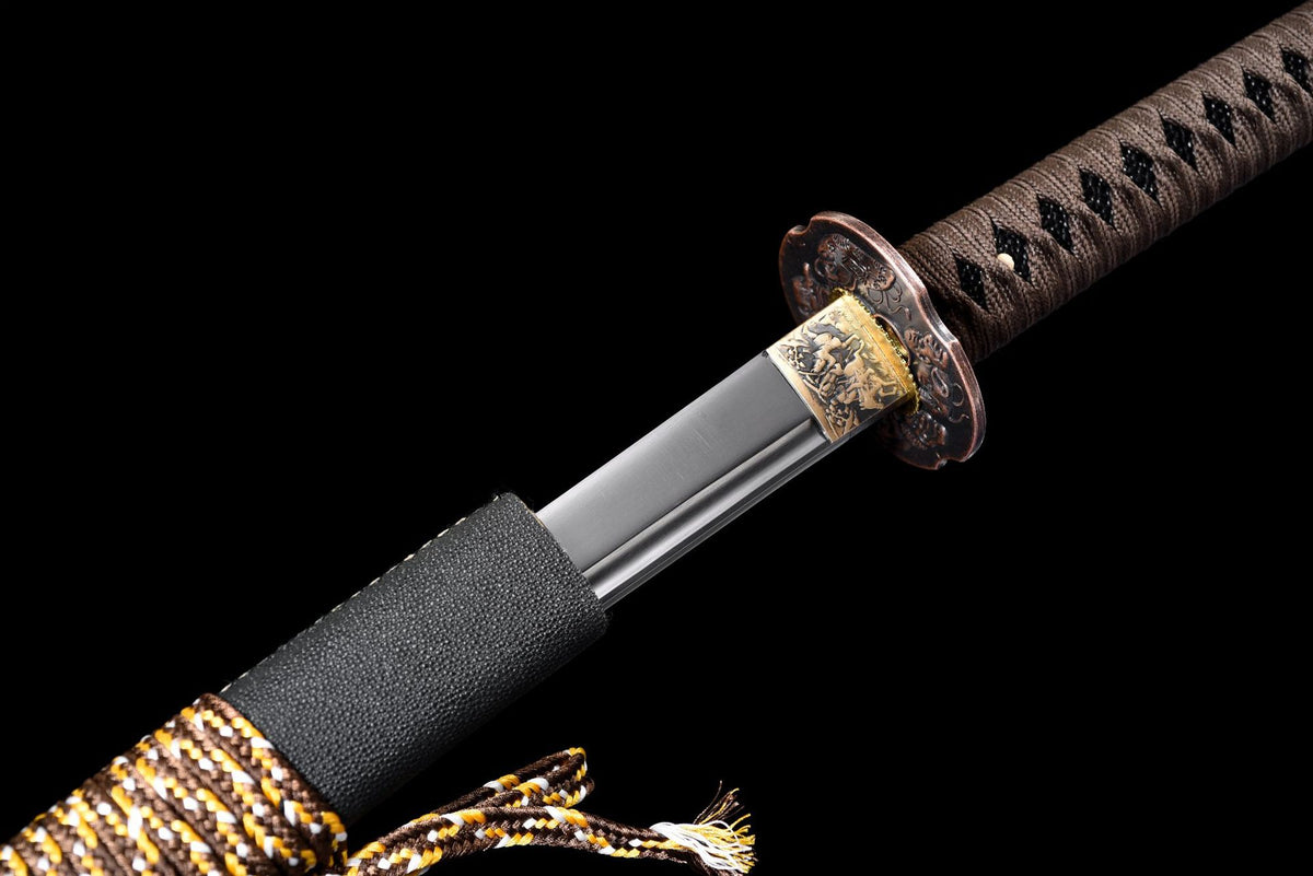 Patterned habaki, six-mask tsuba, and brown-wrapped tsuka during the draw