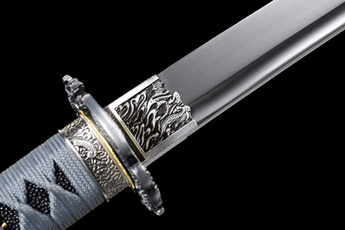 Polished blade base with dragon fittings and gold-toned collar detail