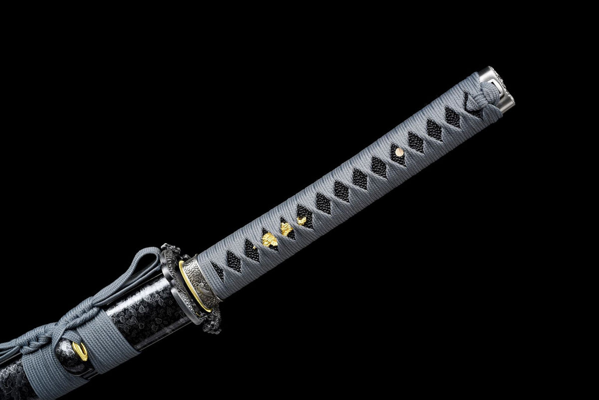 Grey tsuka-ito with black diamond-shaped openings and gold-toned details