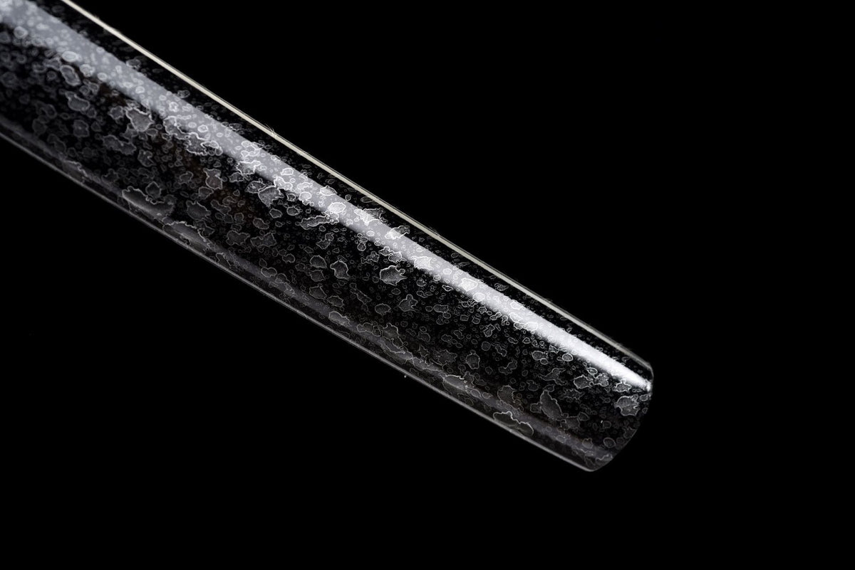 Silver floral pattern on the black solid-wood saya