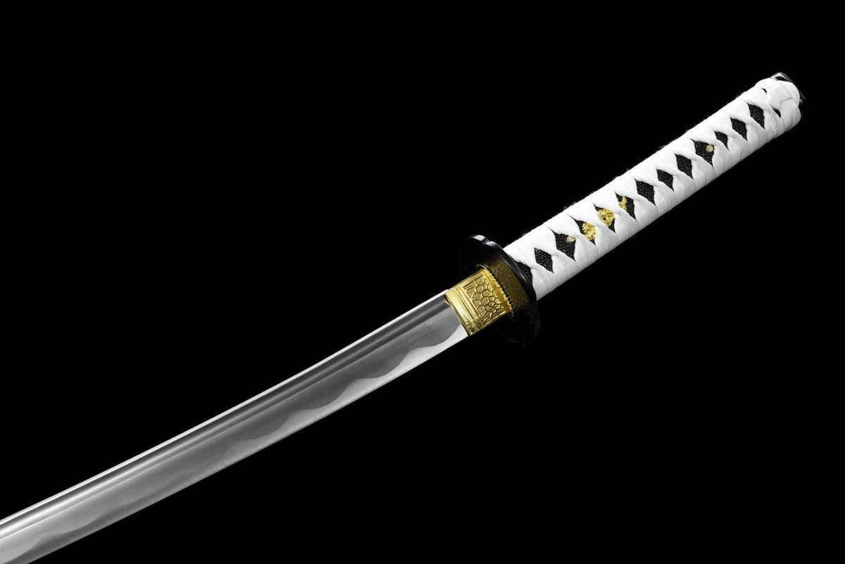 Gold-toned collar and decorative wave line near the blade base