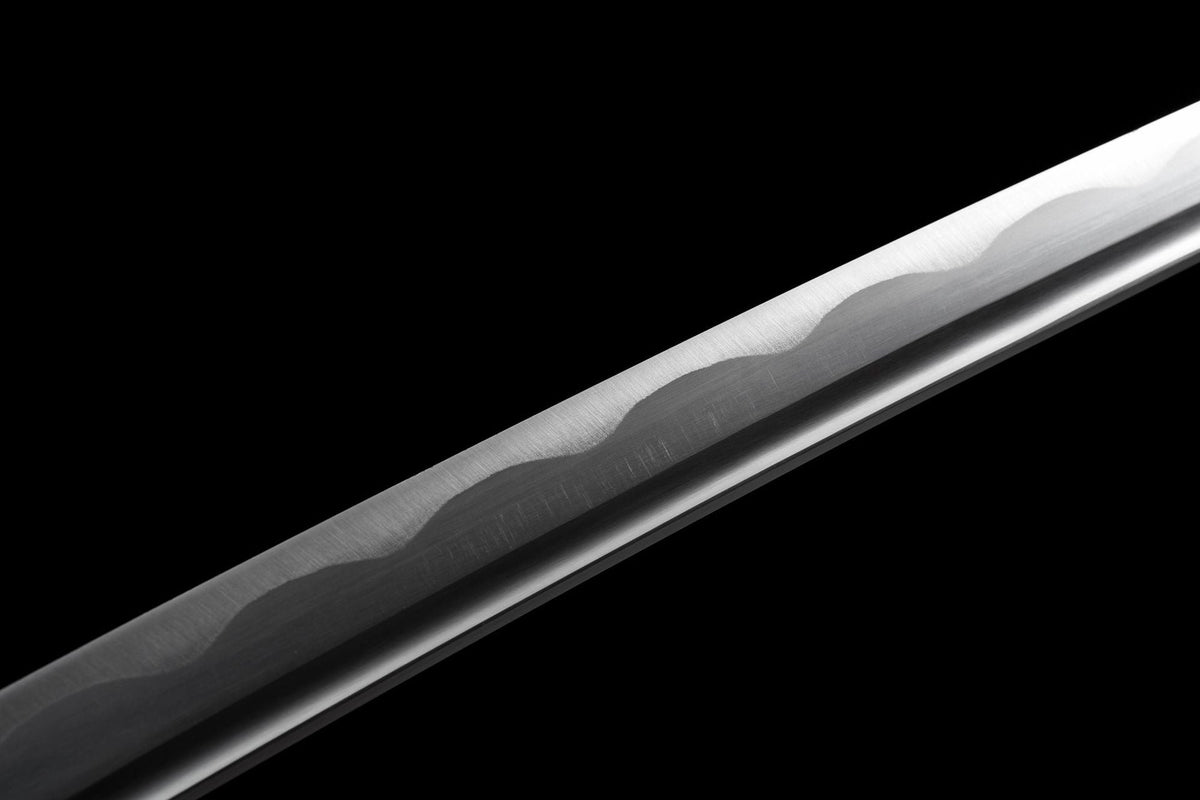 White cord-wrapped handle with black textured guard