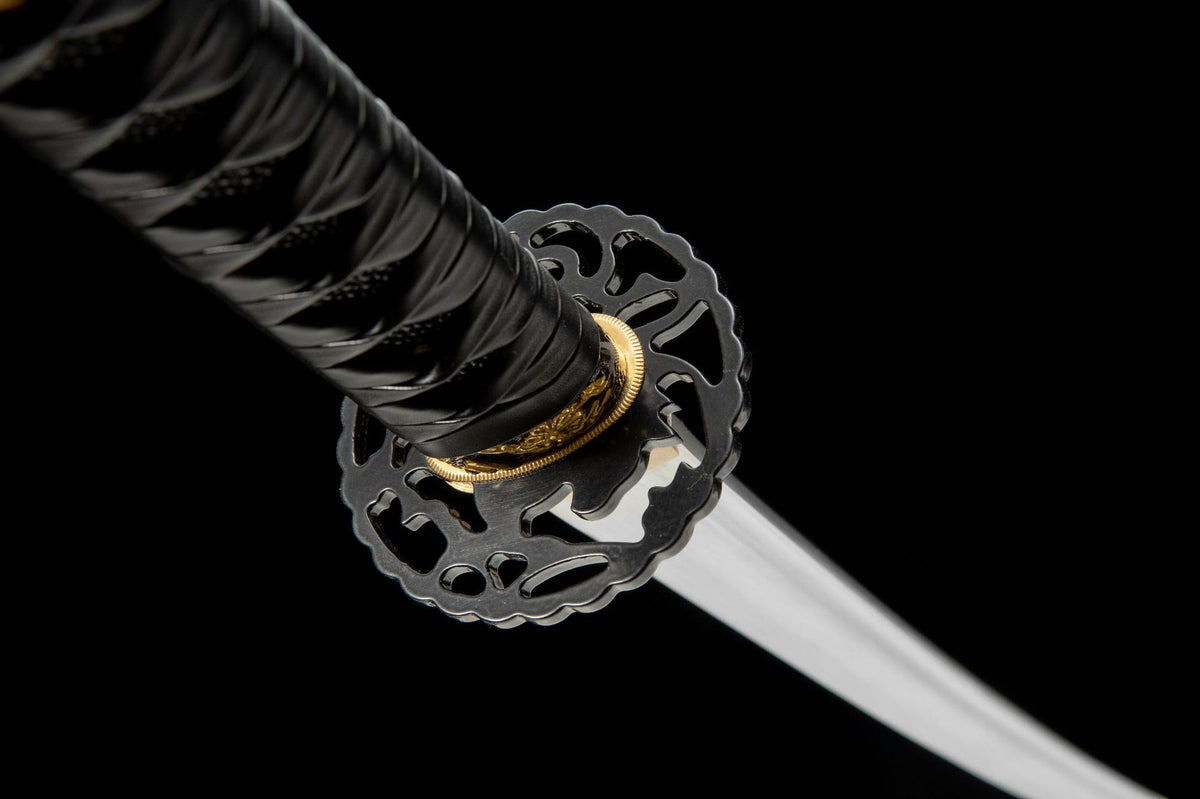 Openwork iron tsuba and copper habaki on the Shirobara Katana