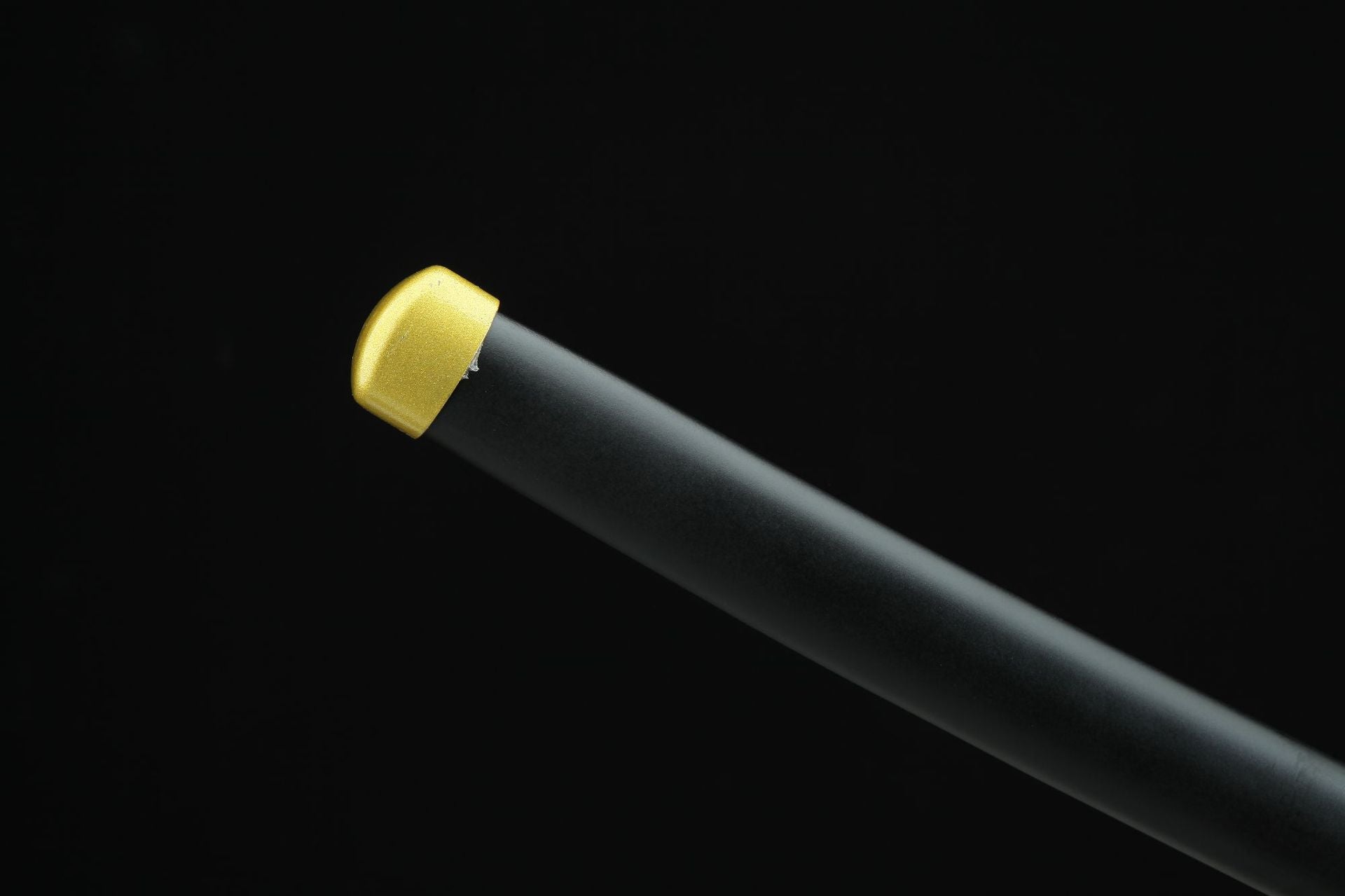 Black scabbard with gold-toned end cap