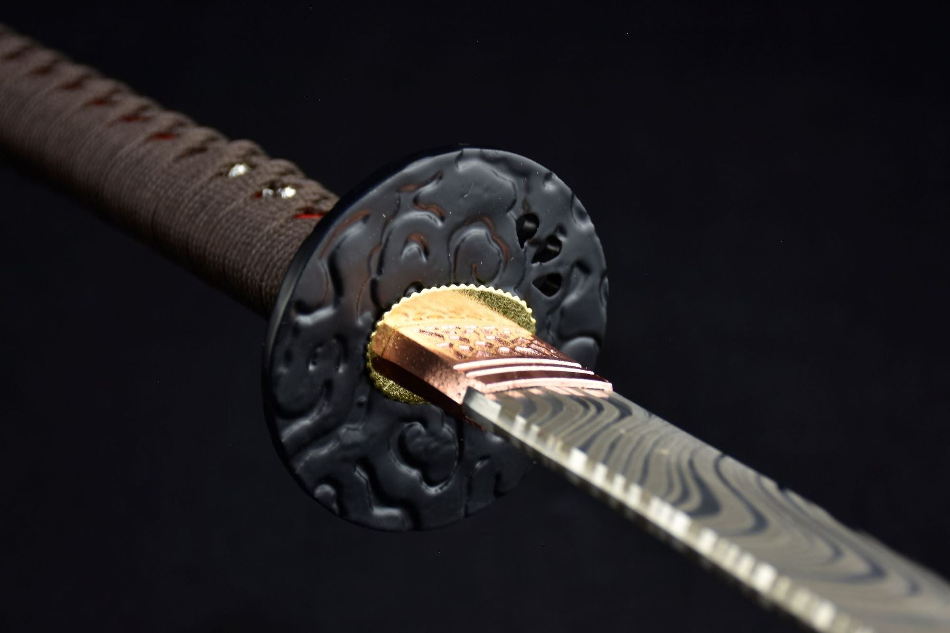 A black round iron tsuba