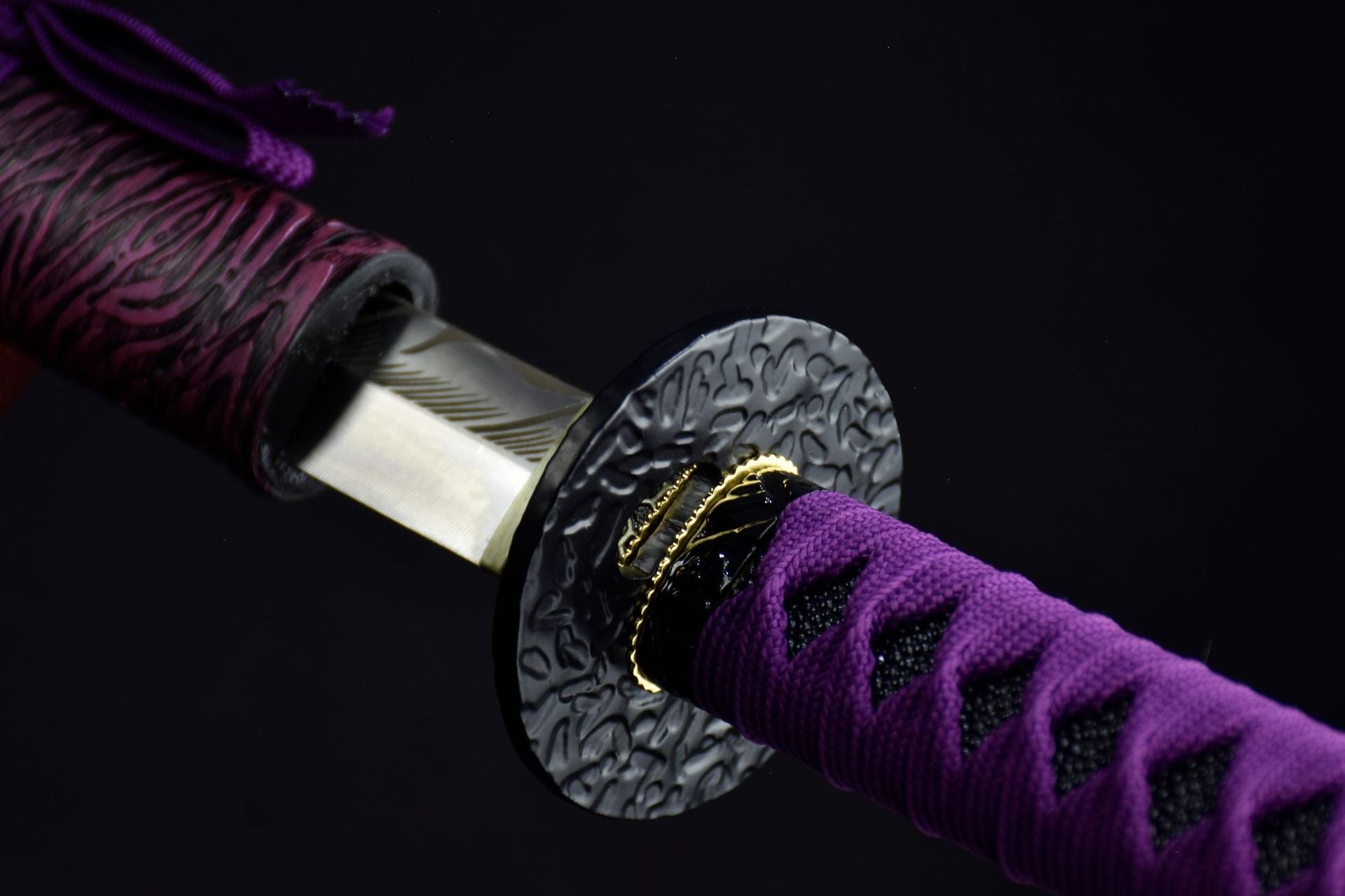 A black round iron tsuba featured on a samurai sword