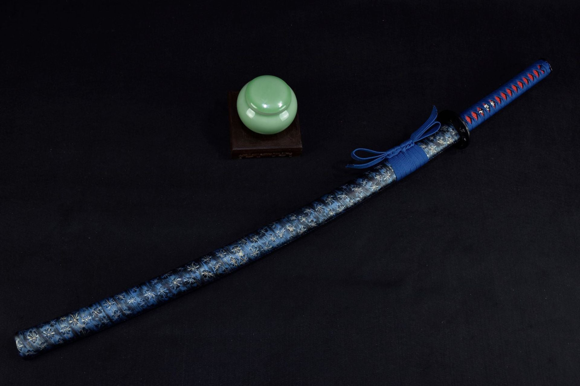 A katana with a blue sheath showcasing sleek craftsmanship