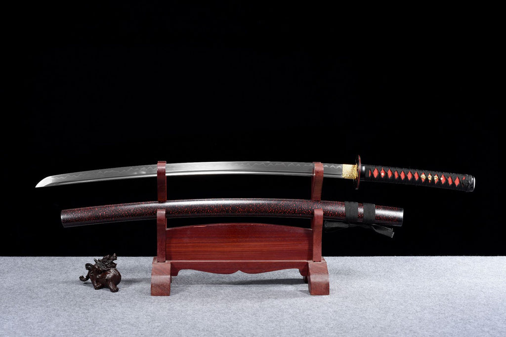 A brown-red clay-tempered carbon steel katana with a polished blade, showcasing traditional craftsmanship.
