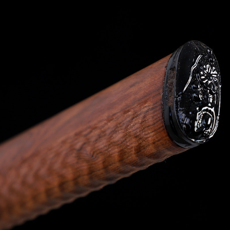 A close-up view of a katana wooden handle