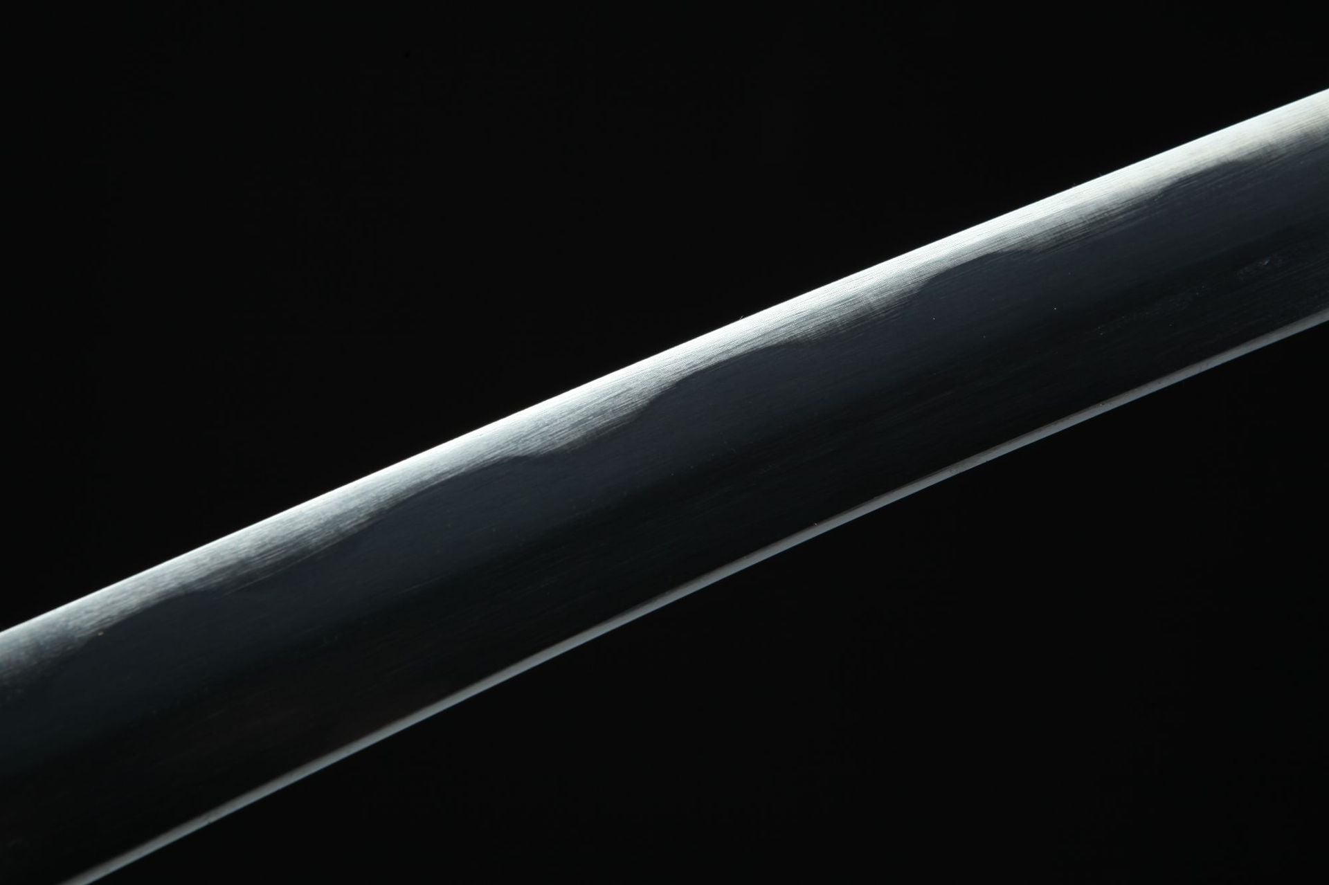 A close-up of the Yubashiri sword from One Piece, showcasing the black body surrounding the blade.