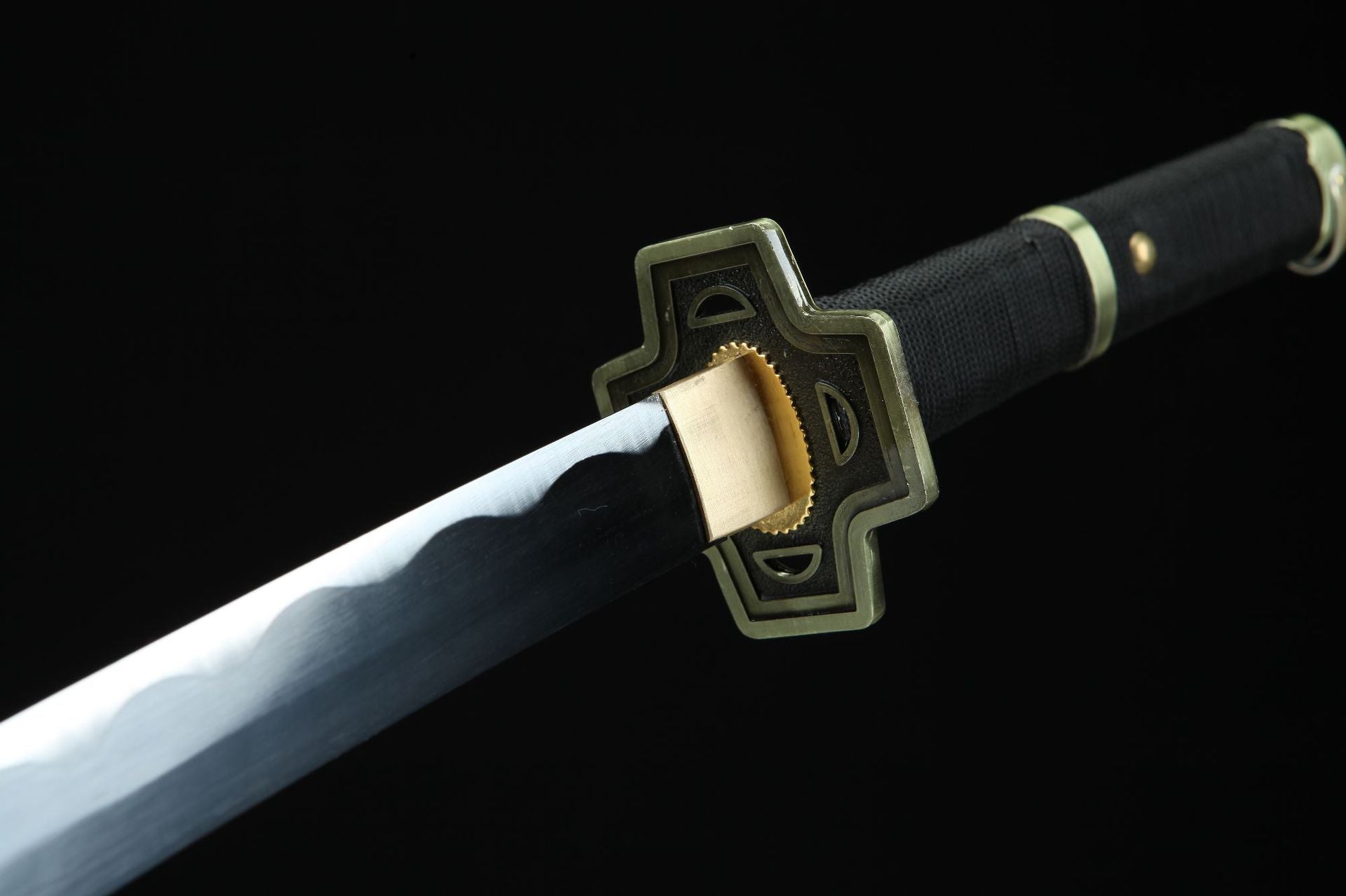 A close-up of Roronoa Zoro's Yubashiri sword guard, featuring a square guard with bronze edges.