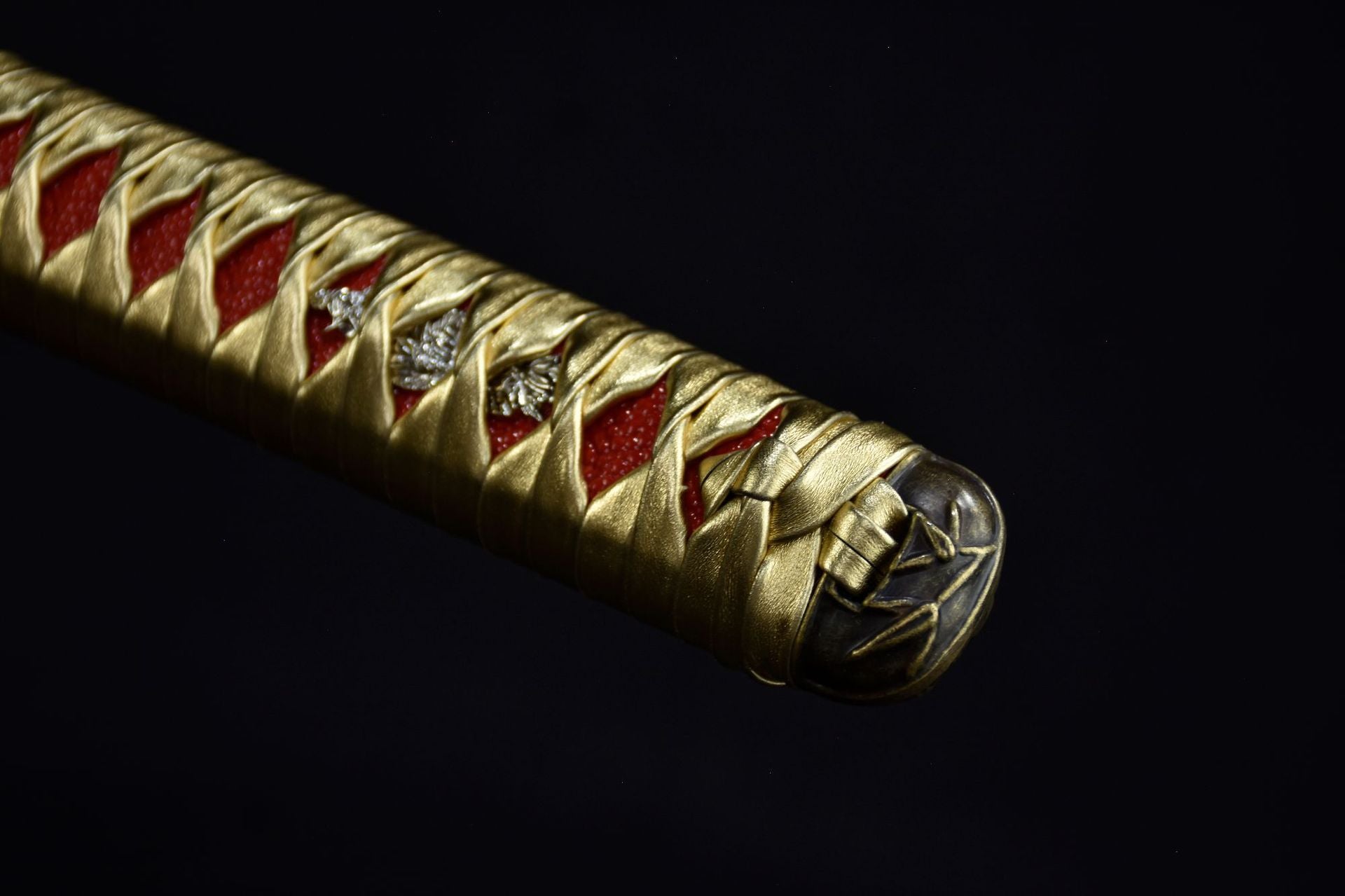 A close-up of the katana handle highlighting its intricate design
