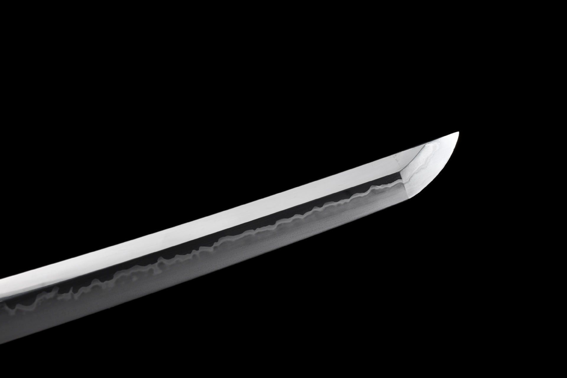 Fire Kirin katana’s kissaki with a wavy hamon pattern.