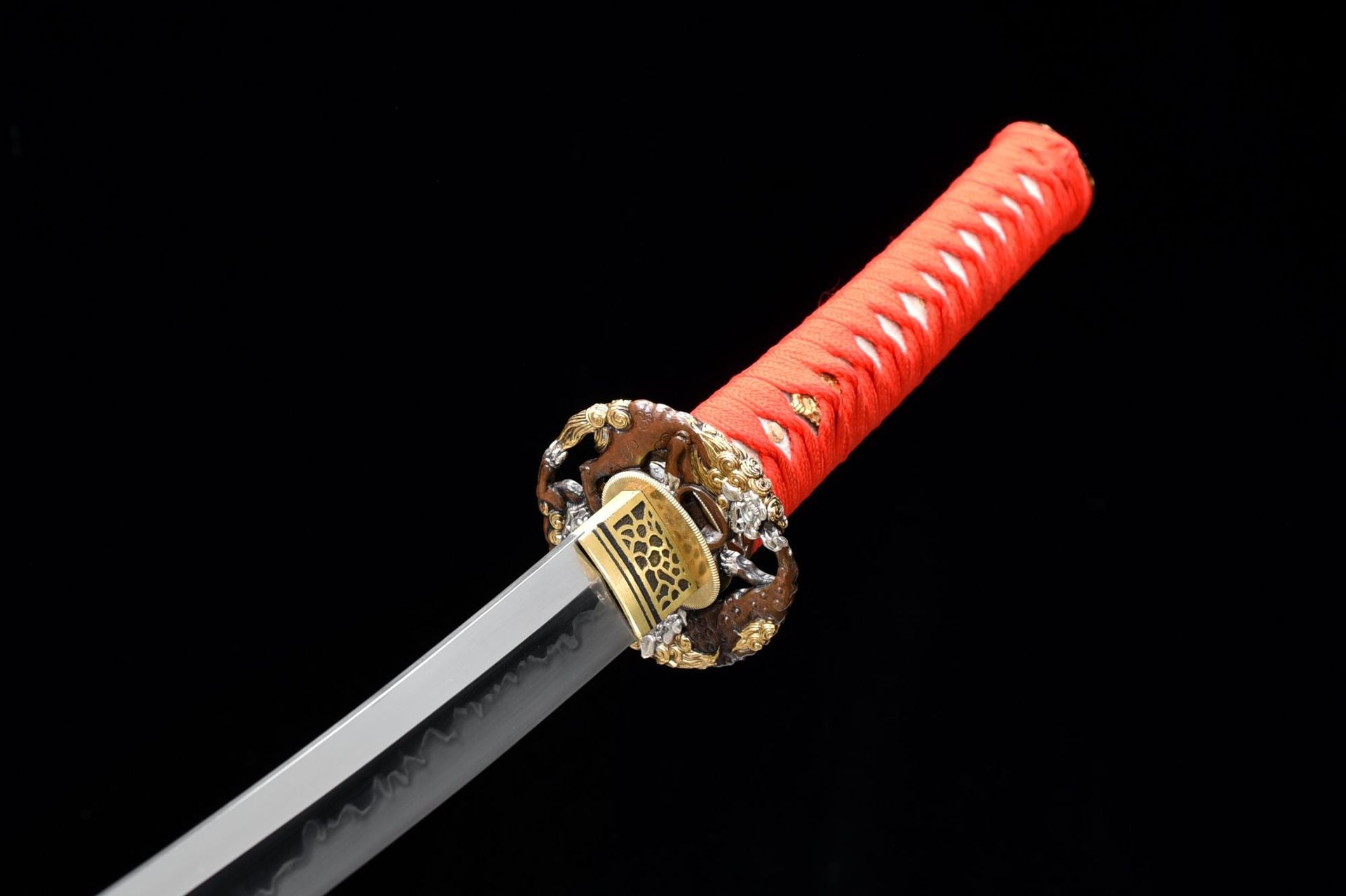 Metal round tsuba on Fire Kirin katana.