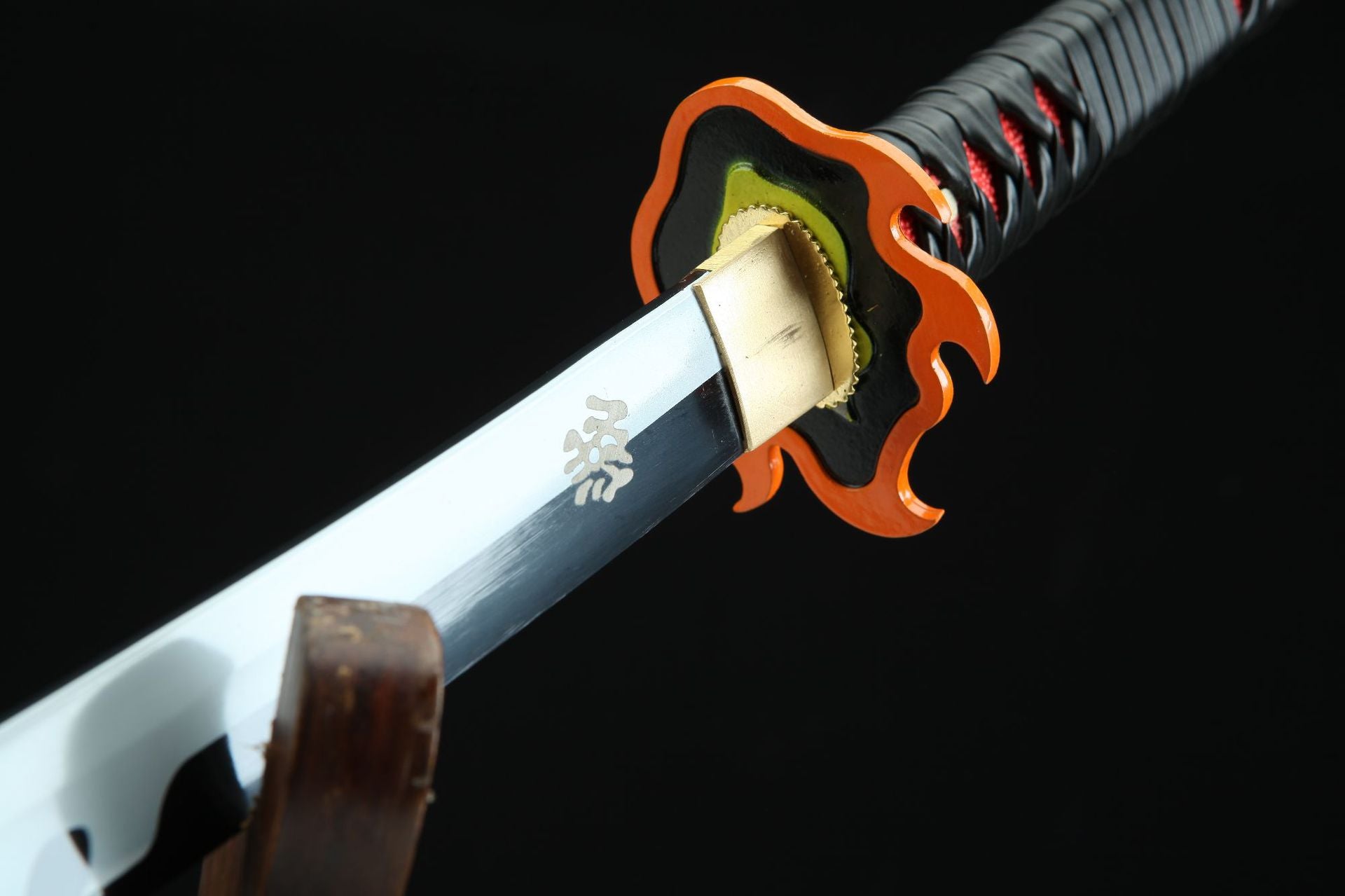 Close-up of Flame Hashira’s flame-shaped guard on Tanjiro’s Nichirin sword from Demon Slayer.