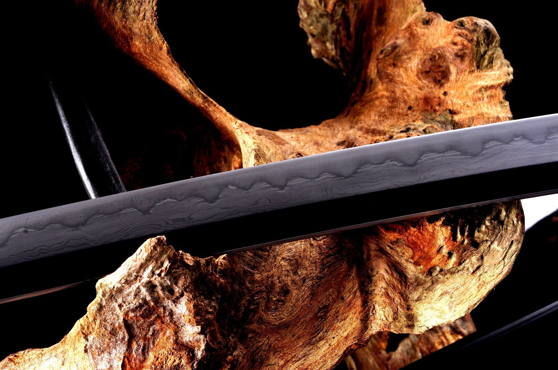 Genji katana blade with kobuse forge and gunome hamon pattern.