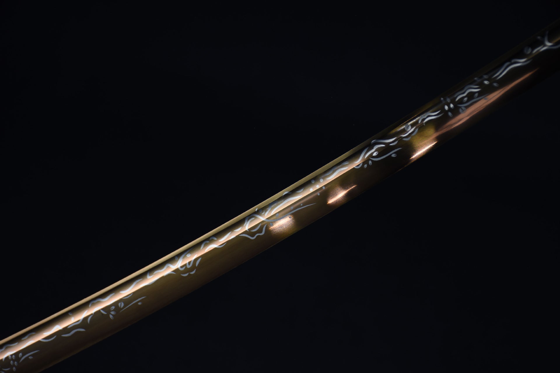 A golden samurai sword blade with sakura painting