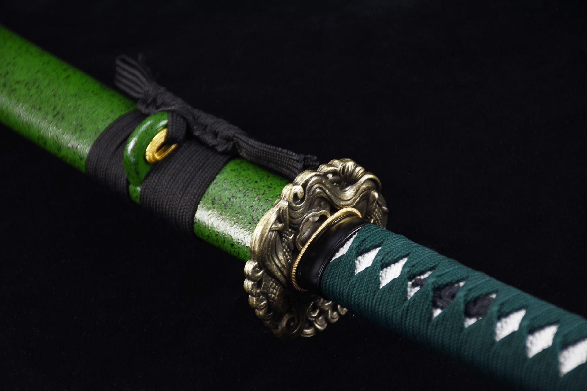Samurai sword with a green handle and matching green scabbard, showcasing its elegant design.