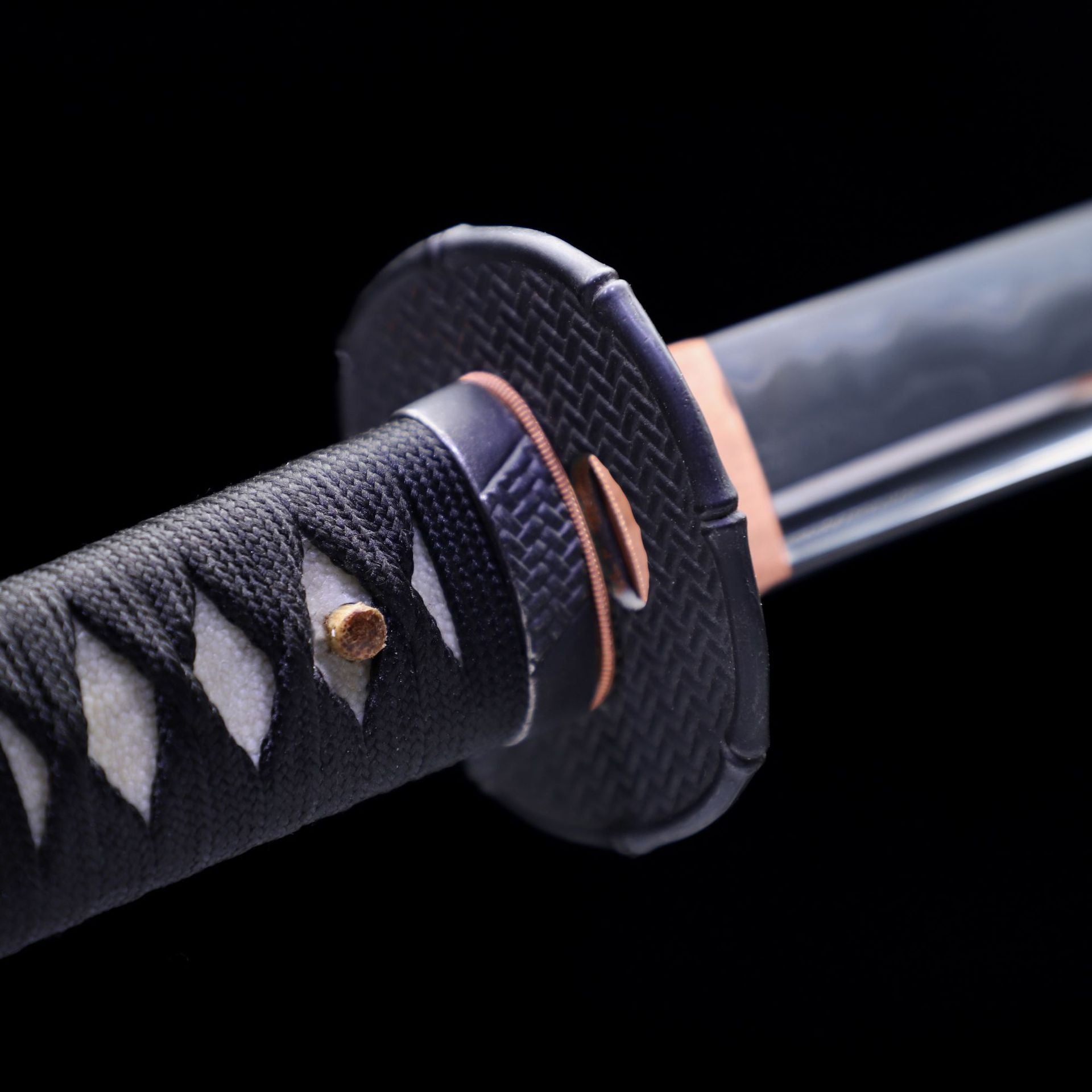 Black metal tsuba of the Guardian katana.