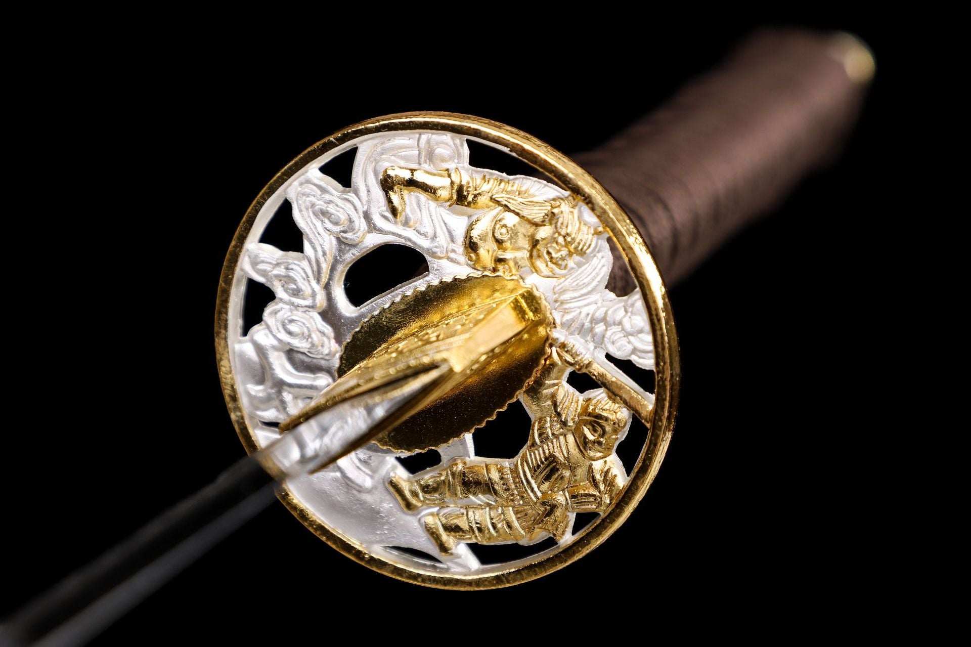 Close-up of the high carbon steel katana tsuba, highlighting the intricate accessory details and craftsmanship.