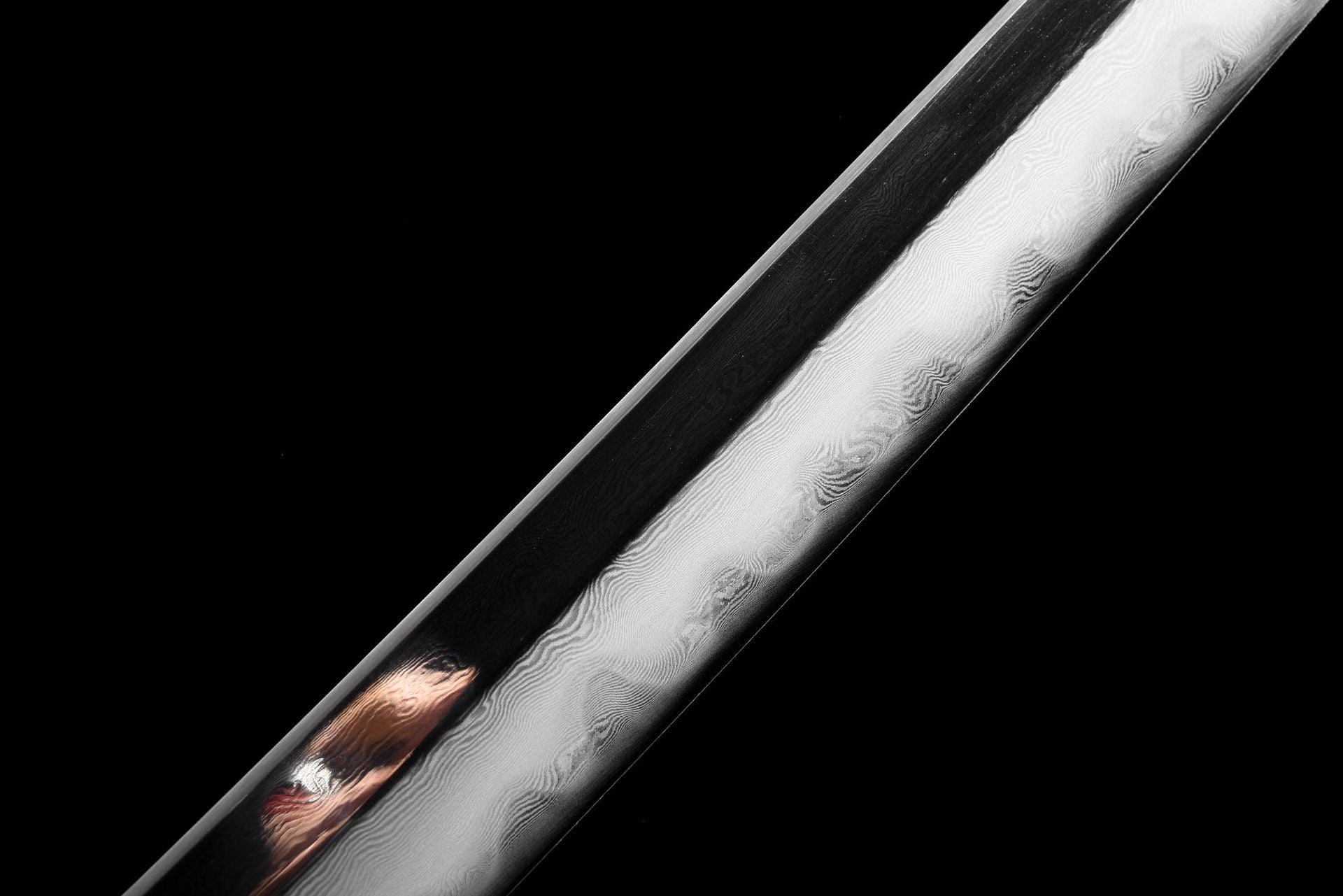 Close-up detail of the Damascus blade on the Immortal Crane katana, featuring exquisite patterns.