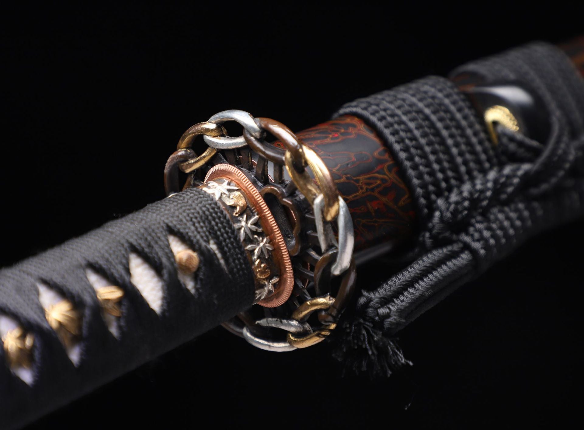 Kiri-giri katana’s chain-link tsuba with gold and silver plating.