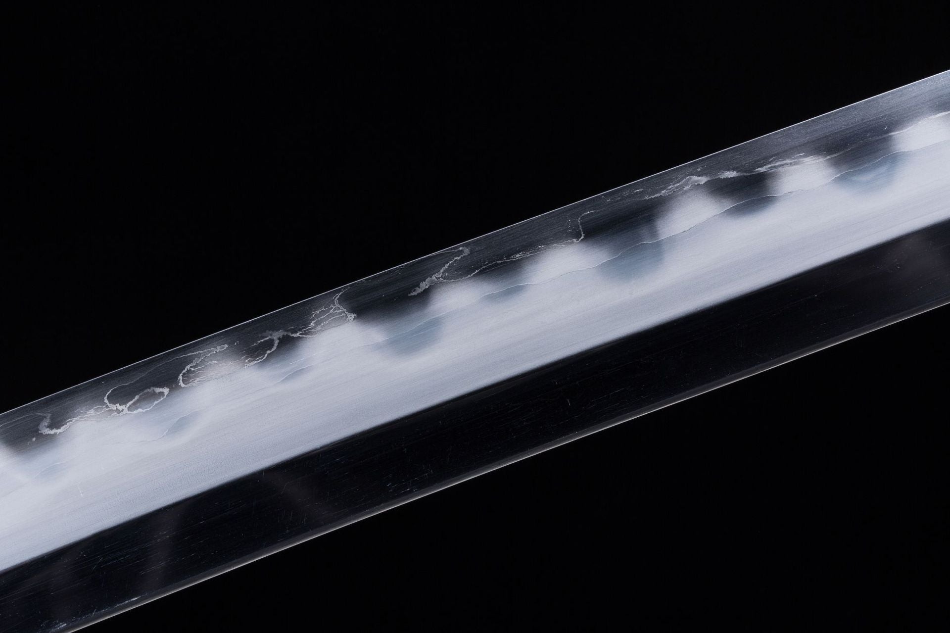 Detail of the sharpened edge on a 7-layer forged blade for a Loong katana.