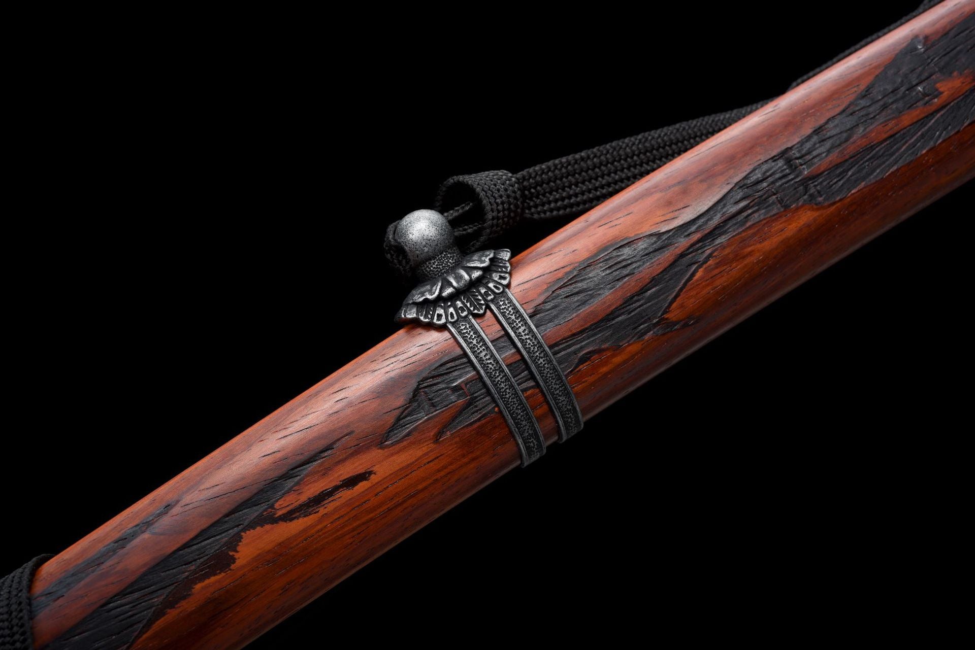 The wooden Saya of the Mortal Blade from Sekiro with an aged finish and black Kurigata.