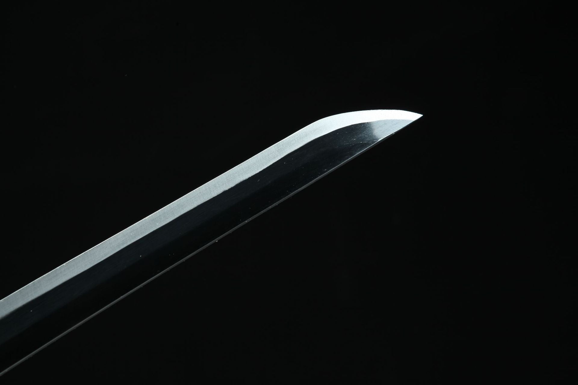 Close-up of Muichiro's sword blade with a black spine and white edge from Demon Slayer.