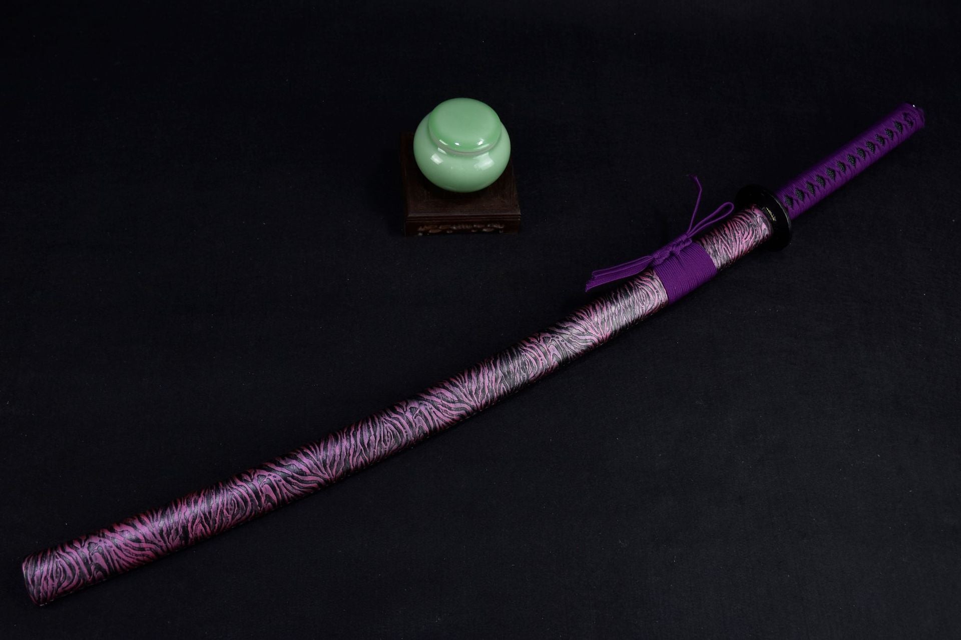 A purple samurai sword with a scabbard, perfect for collectors